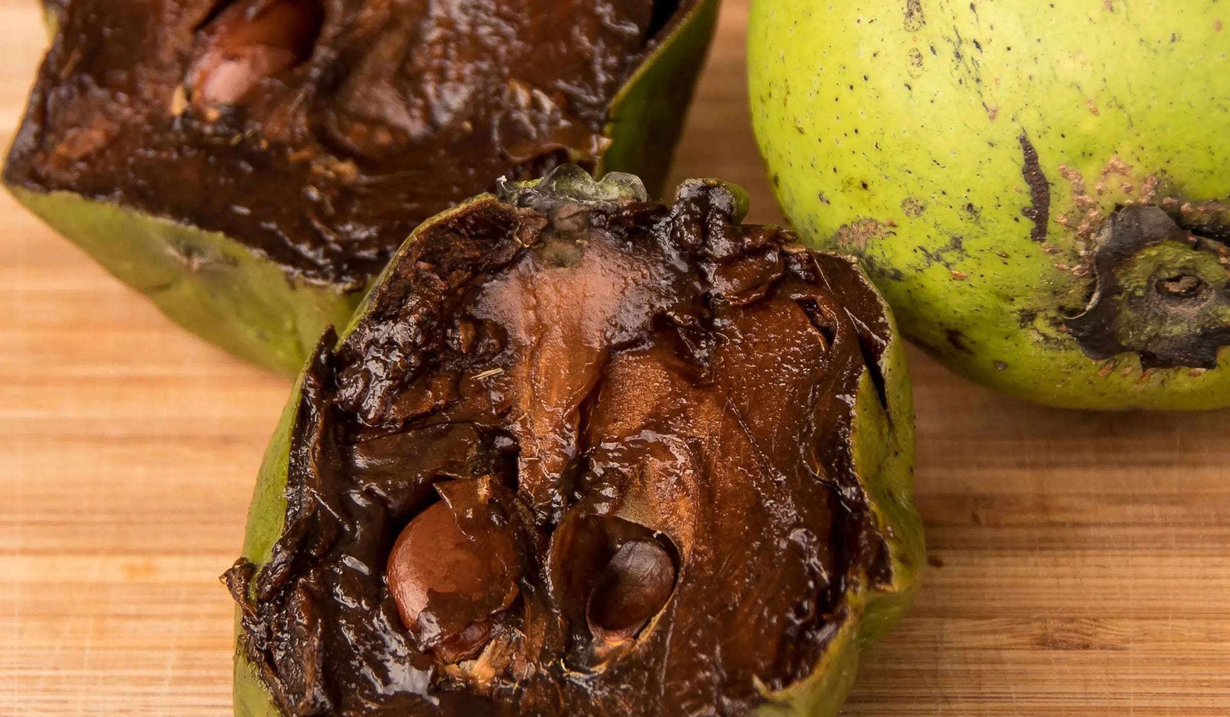 Black sapote cut in half